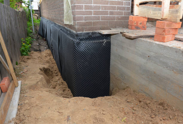 Happy homeowners after waterproofing job in Saint Bonifacius